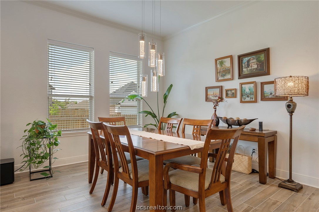 3500 Abingdon Cove Bryan, TX 77808 - Photo 4 of 23 a view of a dining room with furniture and wooden floor