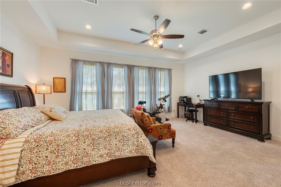 3500 Abingdon Cove Bryan, TX 77808 - Photo 8 of 23 a bedroom with a bed and a flat screen tv