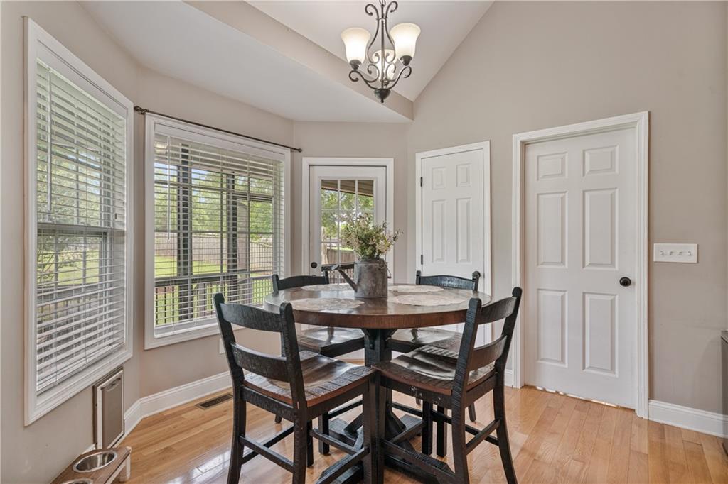 166 Woodford Way Southeast Calhoun, GA 30701 - Photo 19 of 44 a view of a dining room with furniture wooden floor and chandelier