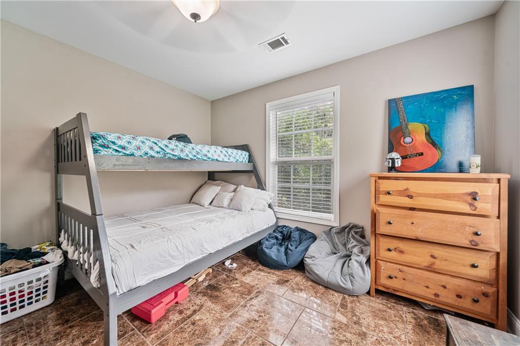 166 Woodford Way Southeast Calhoun, GA 30701 - Photo 33 of 44 a bedroom with a bed and a window