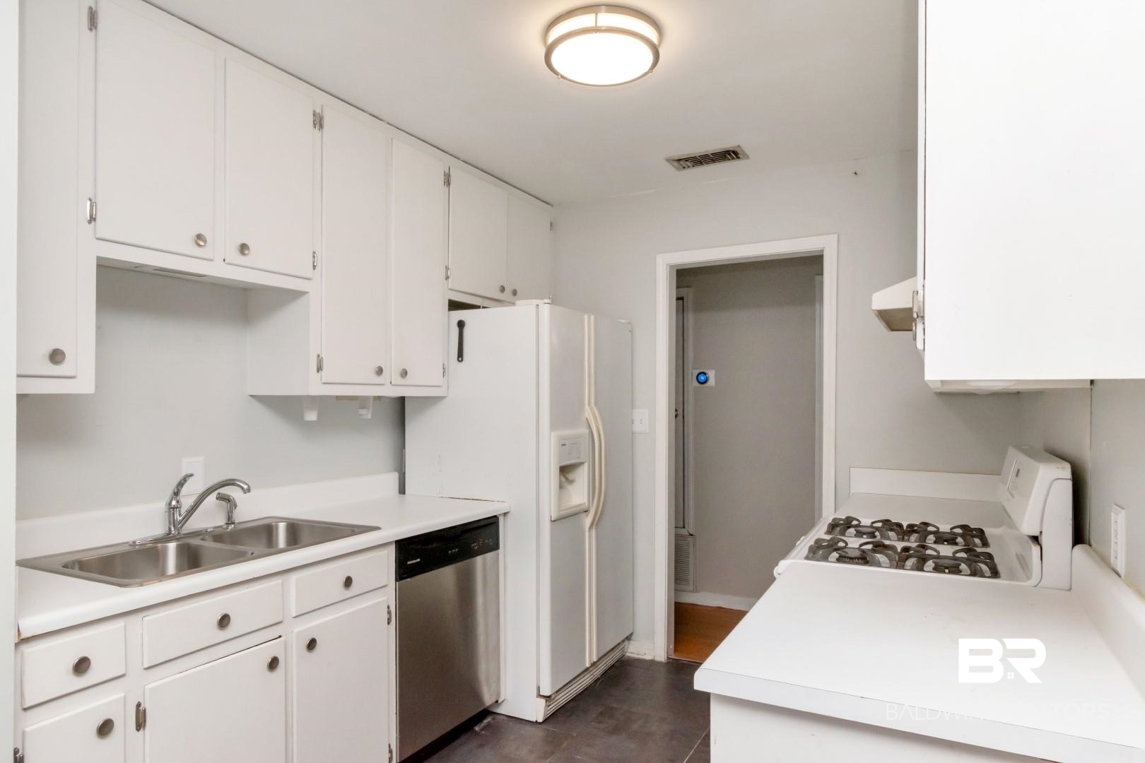 320 Vanderbilt Drive Mobile, AL 36608 - Photo 21 of 39 Kitchen featuring dishwasher, white gas range oven, sink, white cabinets, and extractor fan