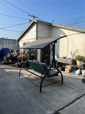 a view of a patio with chairs