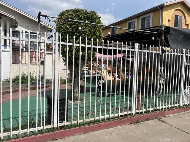 a view of a brick house with many windows