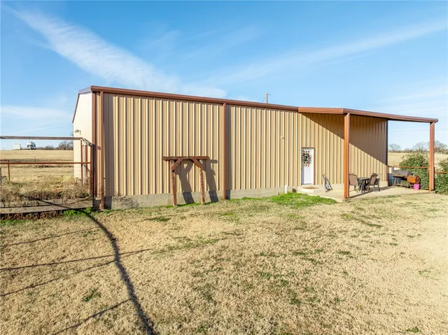 a kitchen with stainless steel appliances granite countertop a refrigerator and a stove