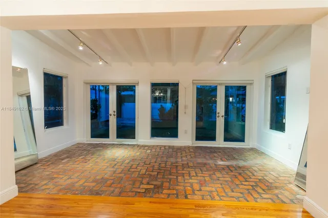 a view of a hall with an entryway