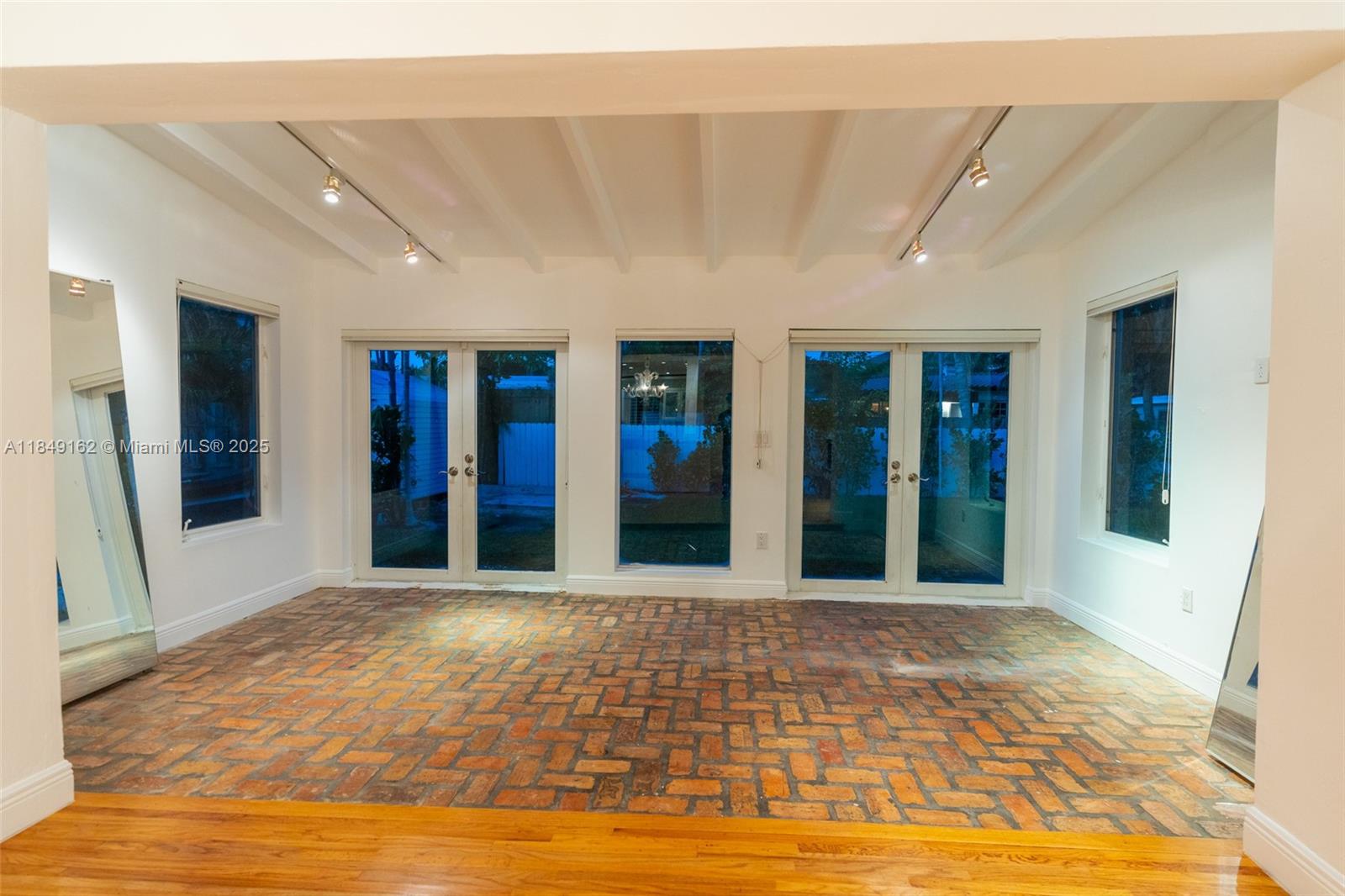 355 Redwood Lane Key Biscayne, FL 33149 - Photo 15 of 34 a view of a hall with an entryway