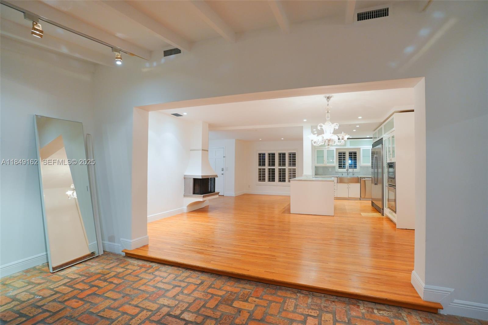 355 Redwood Lane Key Biscayne, FL 33149 - Photo 18 of 34 a view of a livingroom with wooden floor
