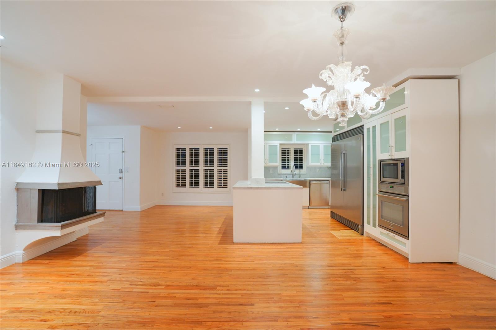 355 Redwood Lane Key Biscayne, FL 33149 - Photo 20 of 34 a view of a kitchen with furniture and wooden floor