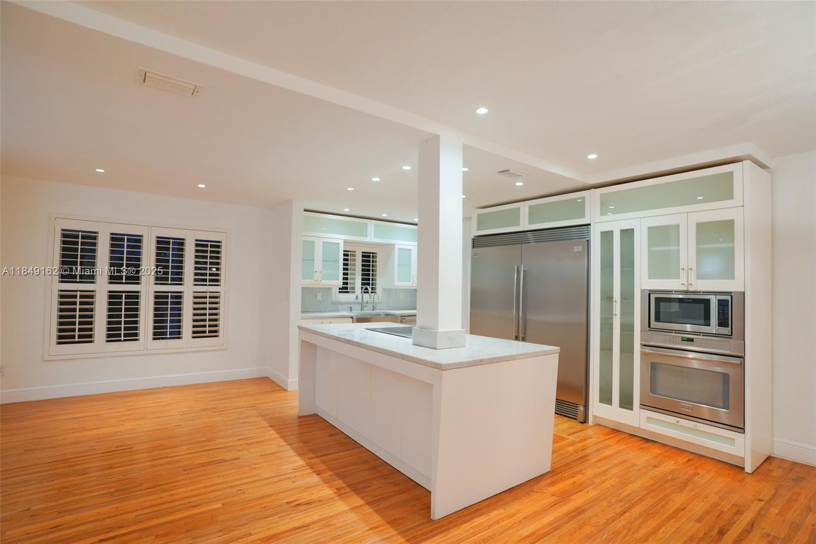 355 Redwood Lane Key Biscayne, FL 33149 - Photo 22 of 34 a bathroom with a sink double vanity and a large mirror