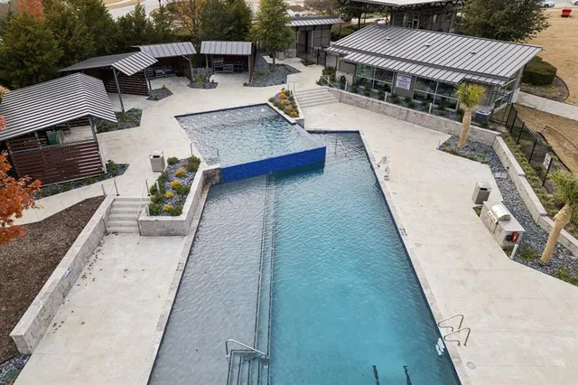 swimming pool view with a outdoor seating space