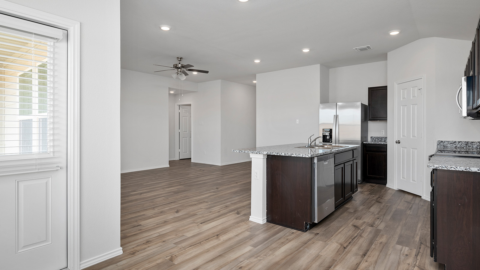 1403 Victory Rnch Trail Killeen, TX 76549 - Photo 8 of 22 Open concept living space featuring wood-look flooring, recessed lighting, and a ceiling fan