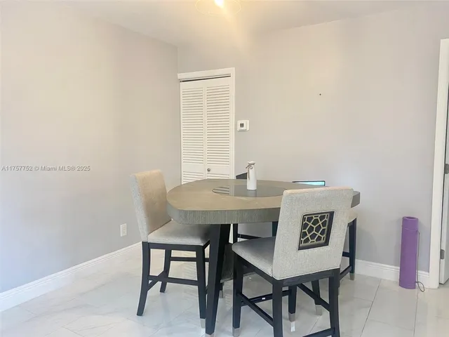 a view of a table and chairs in a room