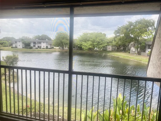a view of a lake from a balcony