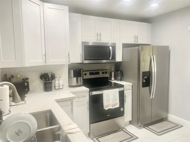 a house view with a backyard space