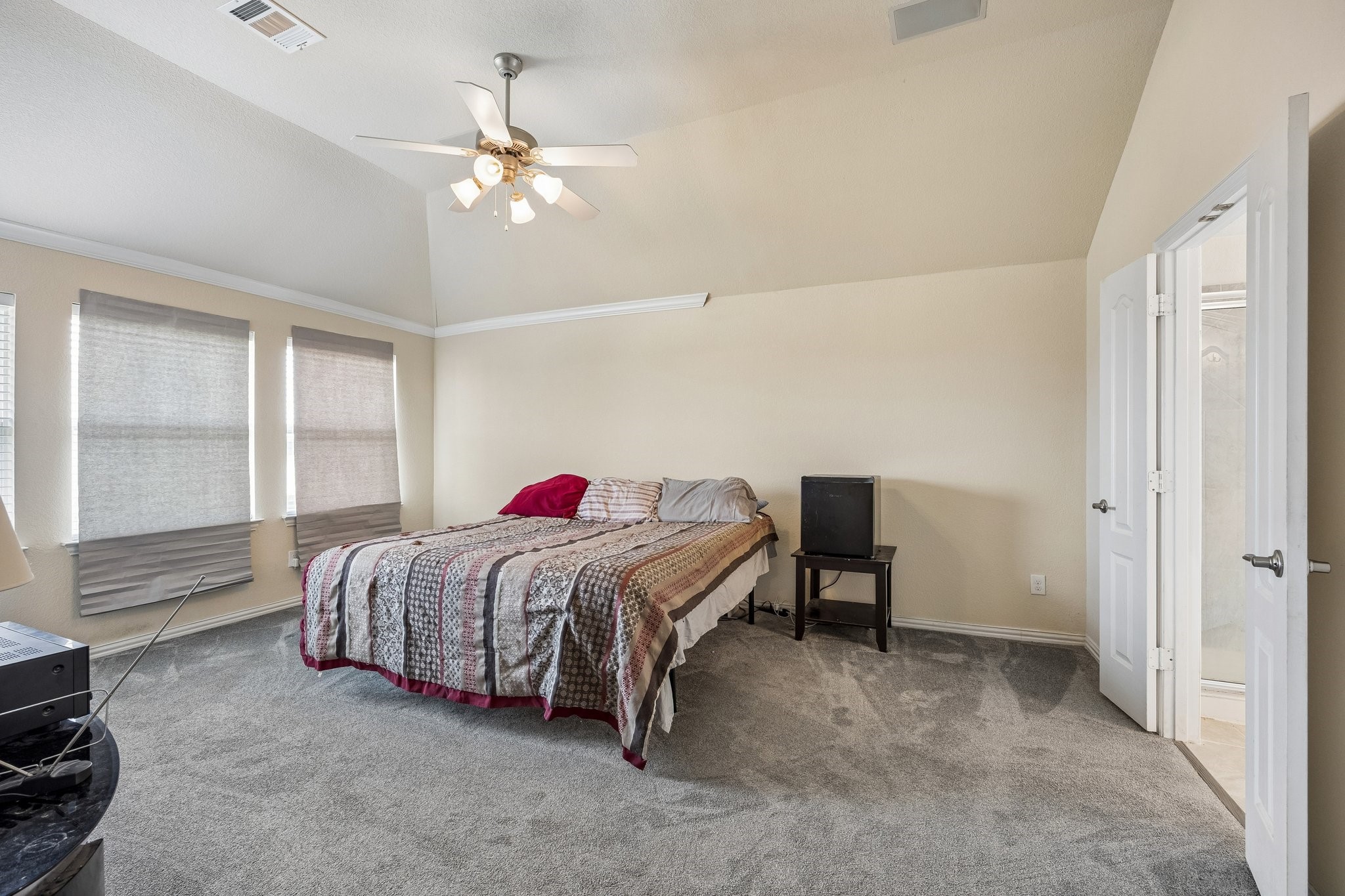 9707 Shimmering Lakes Drive Rosharon, TX 77583 - Photo 10 of 15 a bedroom with a bed and a chandelier