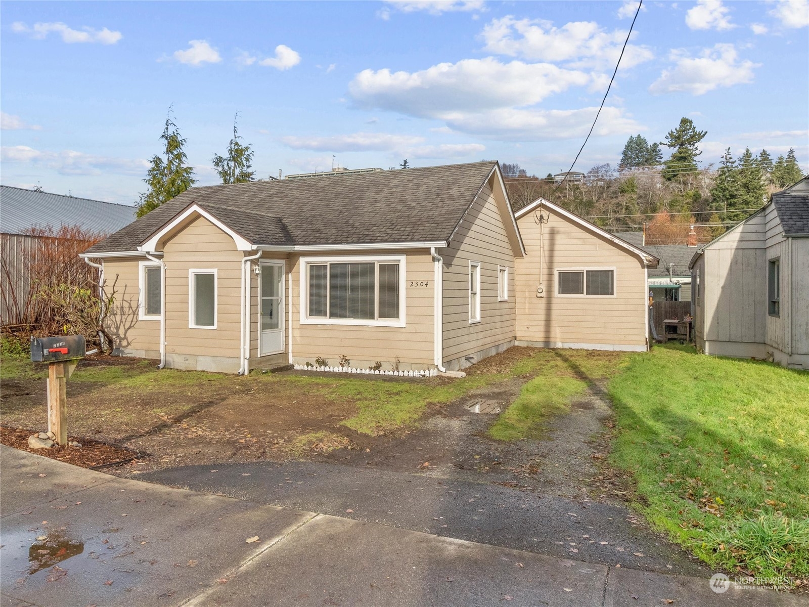 2304 Sumner Avenue Aberdeen, WA 98520 - Photo 1 of 31 a view of a yard in front of a house with a garden