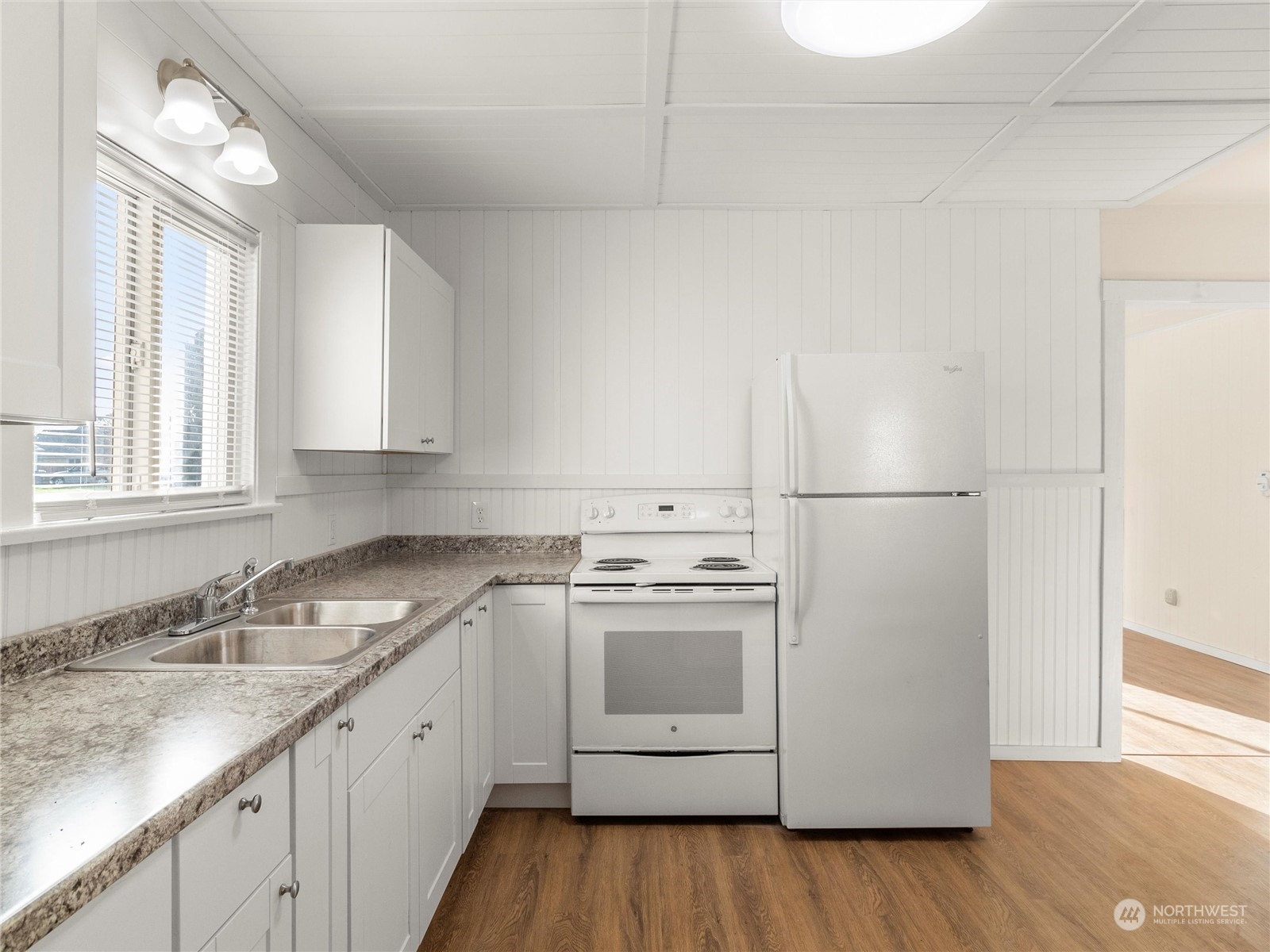2304 Sumner Avenue Aberdeen, WA 98520 - Photo 12 of 31 a kitchen with a sink cabinets and wooden floor