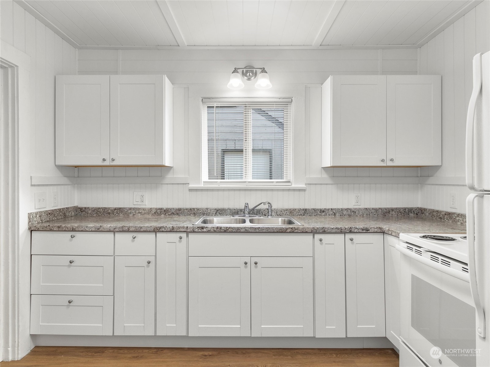 2304 Sumner Avenue Aberdeen, WA 98520 - Photo 14 of 31 a kitchen with granite countertop white cabinets and sink