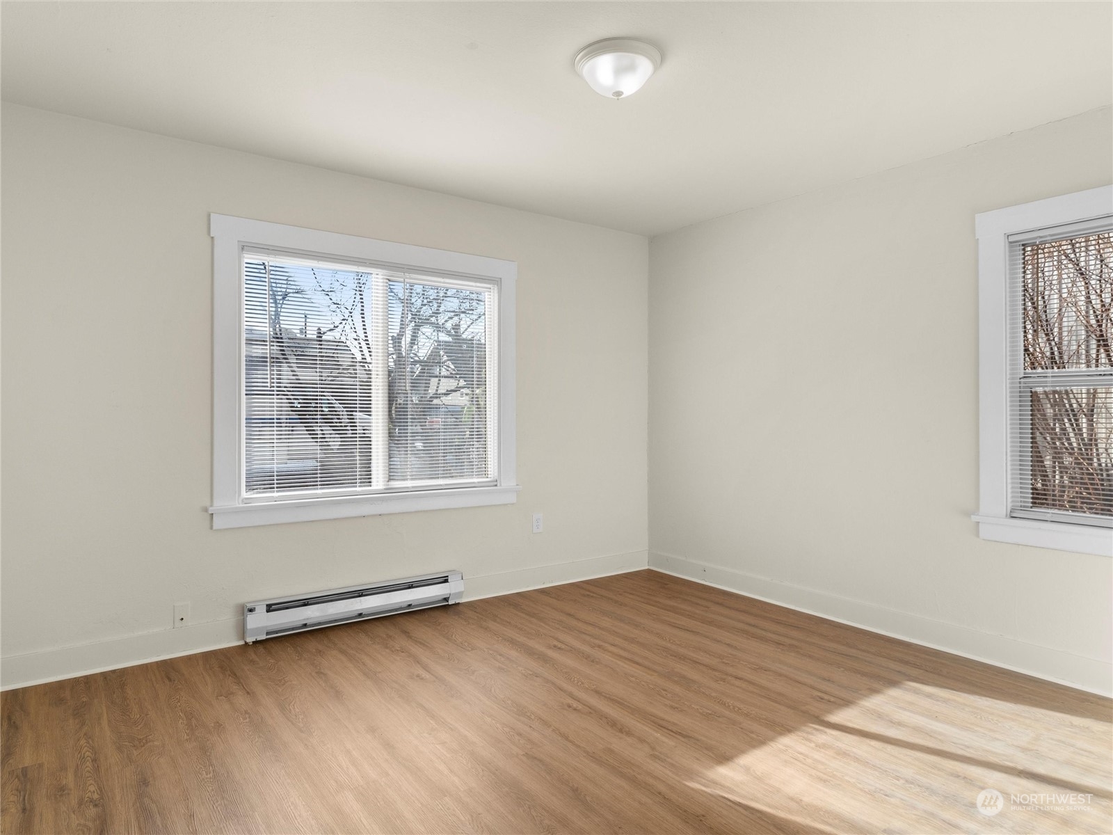 2304 Sumner Avenue Aberdeen, WA 98520 - Photo 15 of 31 an empty room with wooden floor and windows