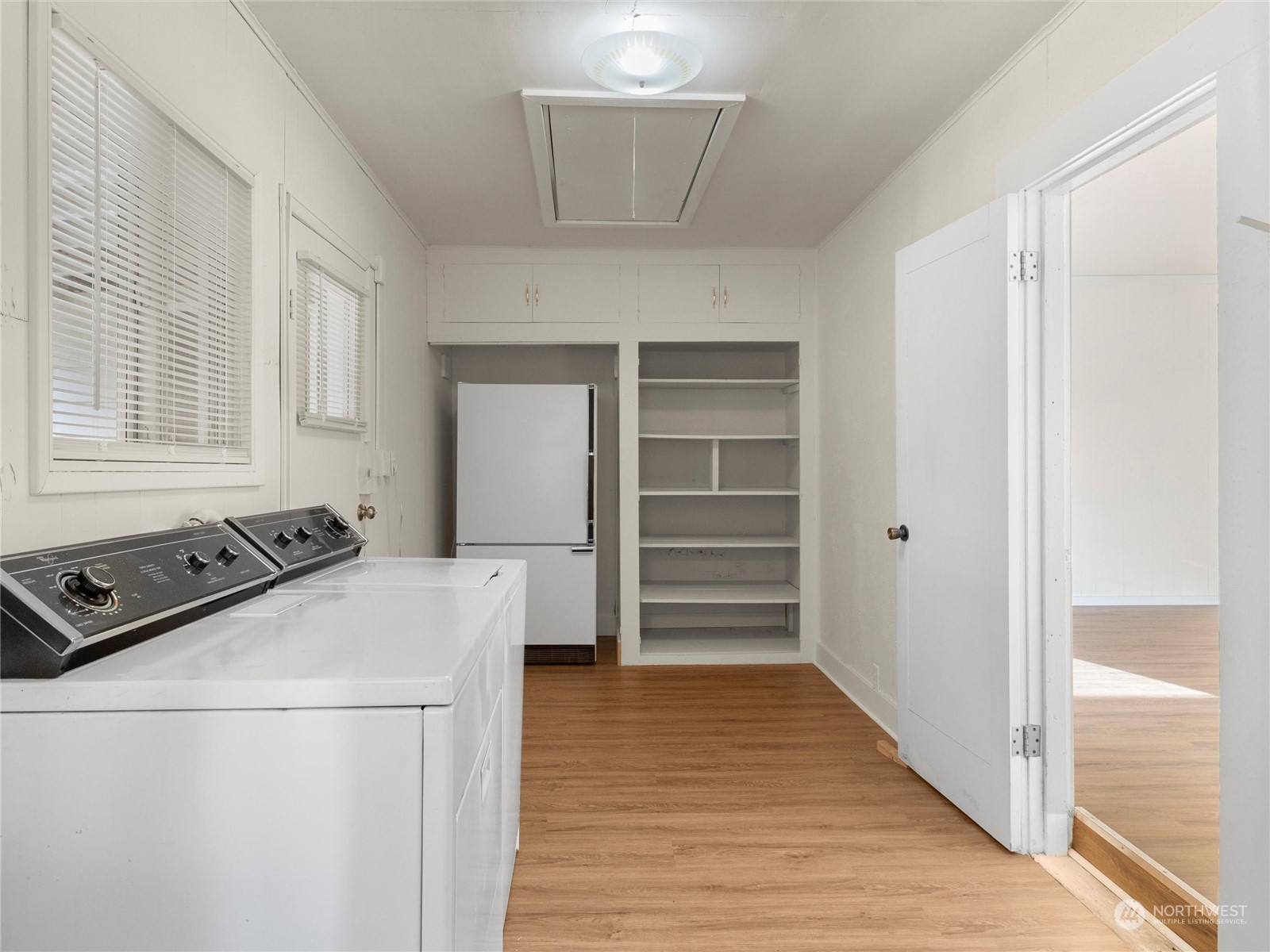 2304 Sumner Avenue Aberdeen, WA 98520 - Photo 21 of 31 a view of a kitchen with wooden floor and electronic appliances