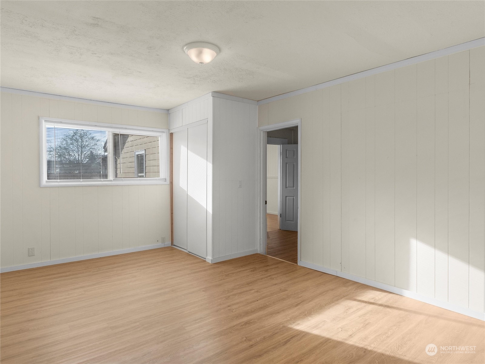2304 Sumner Avenue Aberdeen, WA 98520 - Photo 24 of 31 a view of an empty room with wooden floor and a window