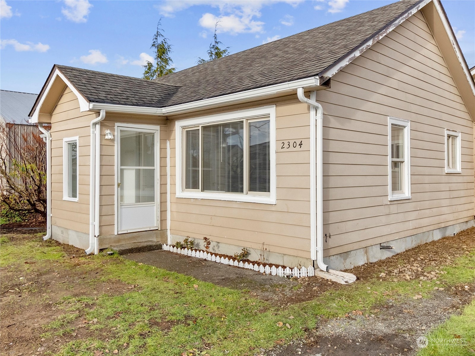 2304 Sumner Avenue Aberdeen, WA 98520 - Photo 5 of 31 a view of a house with wooden fence