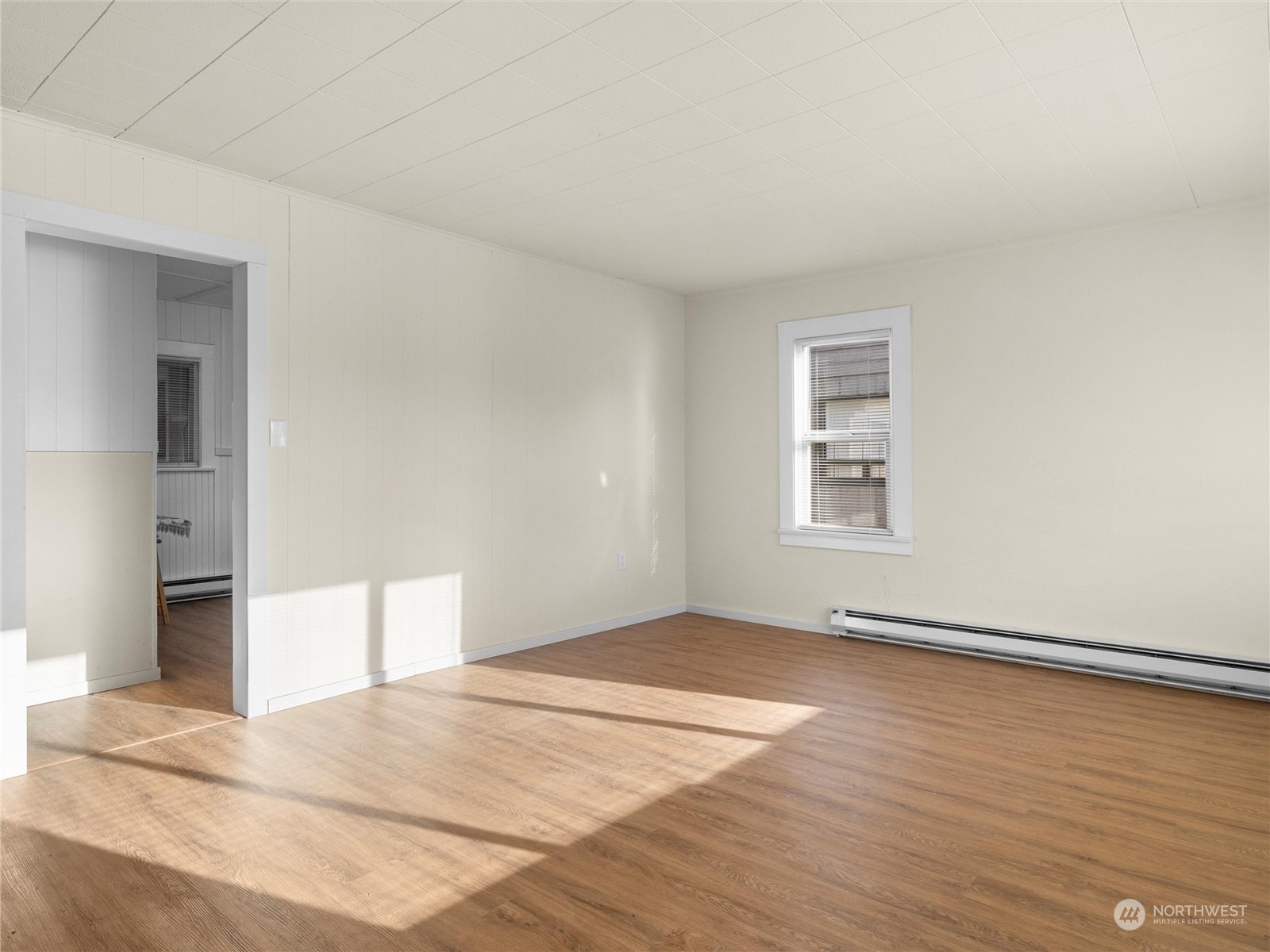 2304 Sumner Avenue Aberdeen, WA 98520 - Photo 8 of 31 an empty room with wooden floor and windows