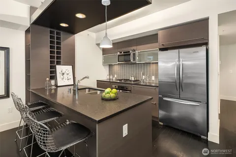 a bedroom with a bed and a potted plant