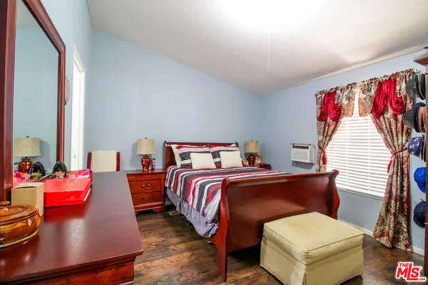 a bed room with a bed and a couch