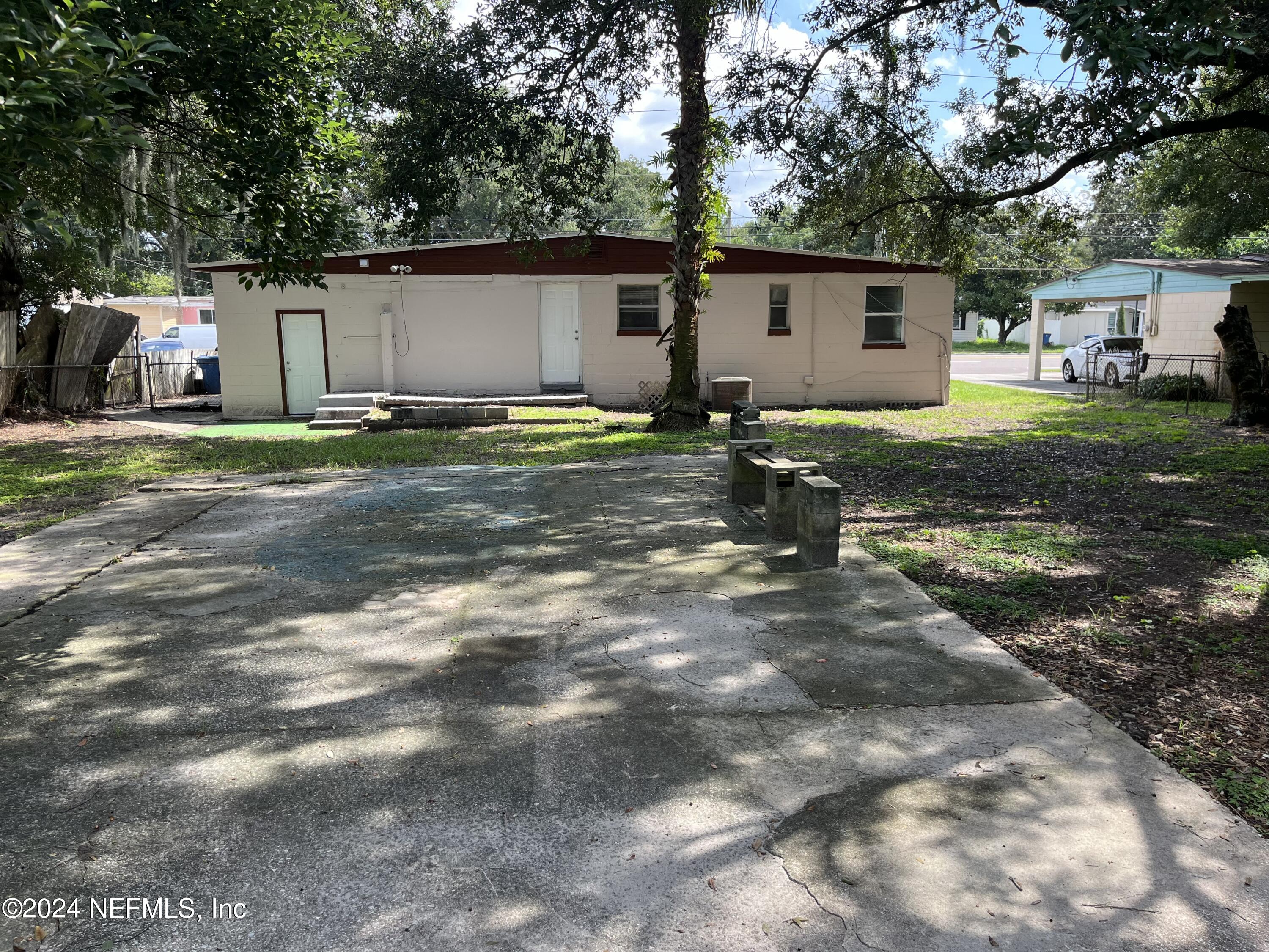 2414 Rogero Road Jacksonville, FL 32211 - Photo 10 of 13 back yard to house