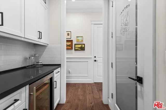 a kitchen with stainless steel appliances granite countertop a stove and a refrigerator