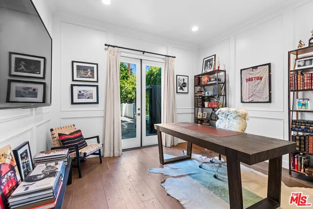 a room with furniture pool table and windows