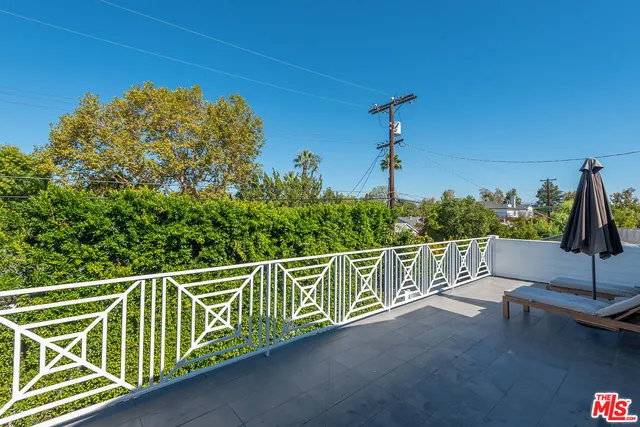a view of a city street from a balcony