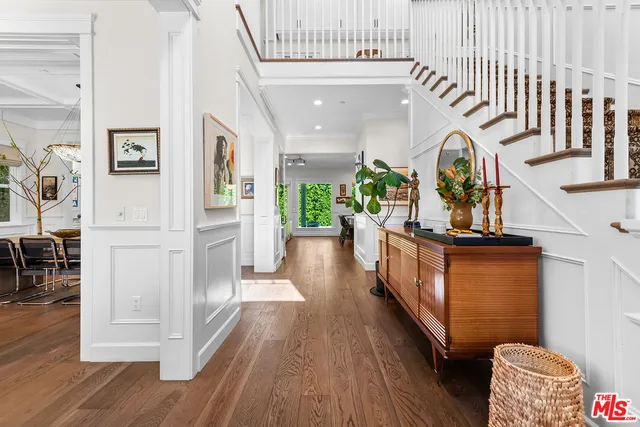 a view of entryway with wooden floor