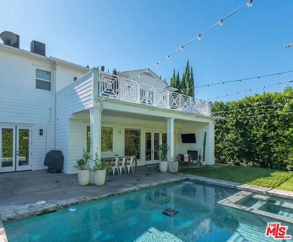 a view of a building with potted plants