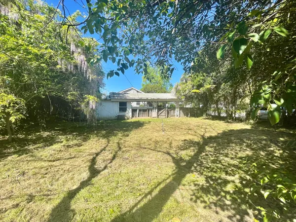 a house with swimming pool in front of it