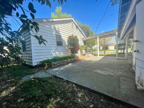 a view of a street with brick walls