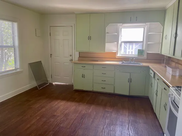 a spacious bathroom with a double vanity sink and a large mirror