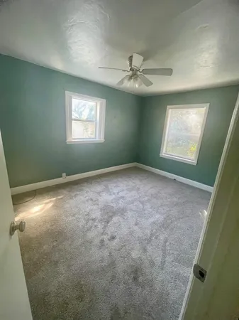 a view of empty room with windows