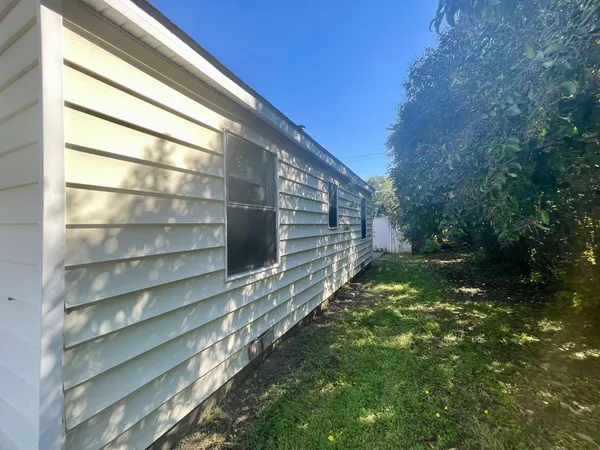 a backyard of a house with lots of green space