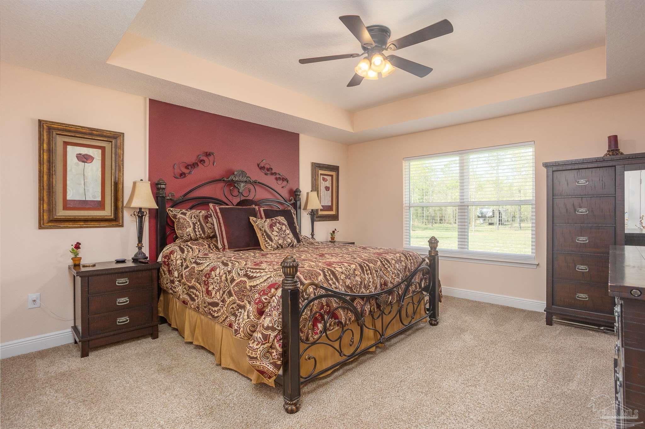2383 Bud Diamond Road Jay, FL 32565 - Photo 17 of 50 a bedroom with a bed dresser and a window