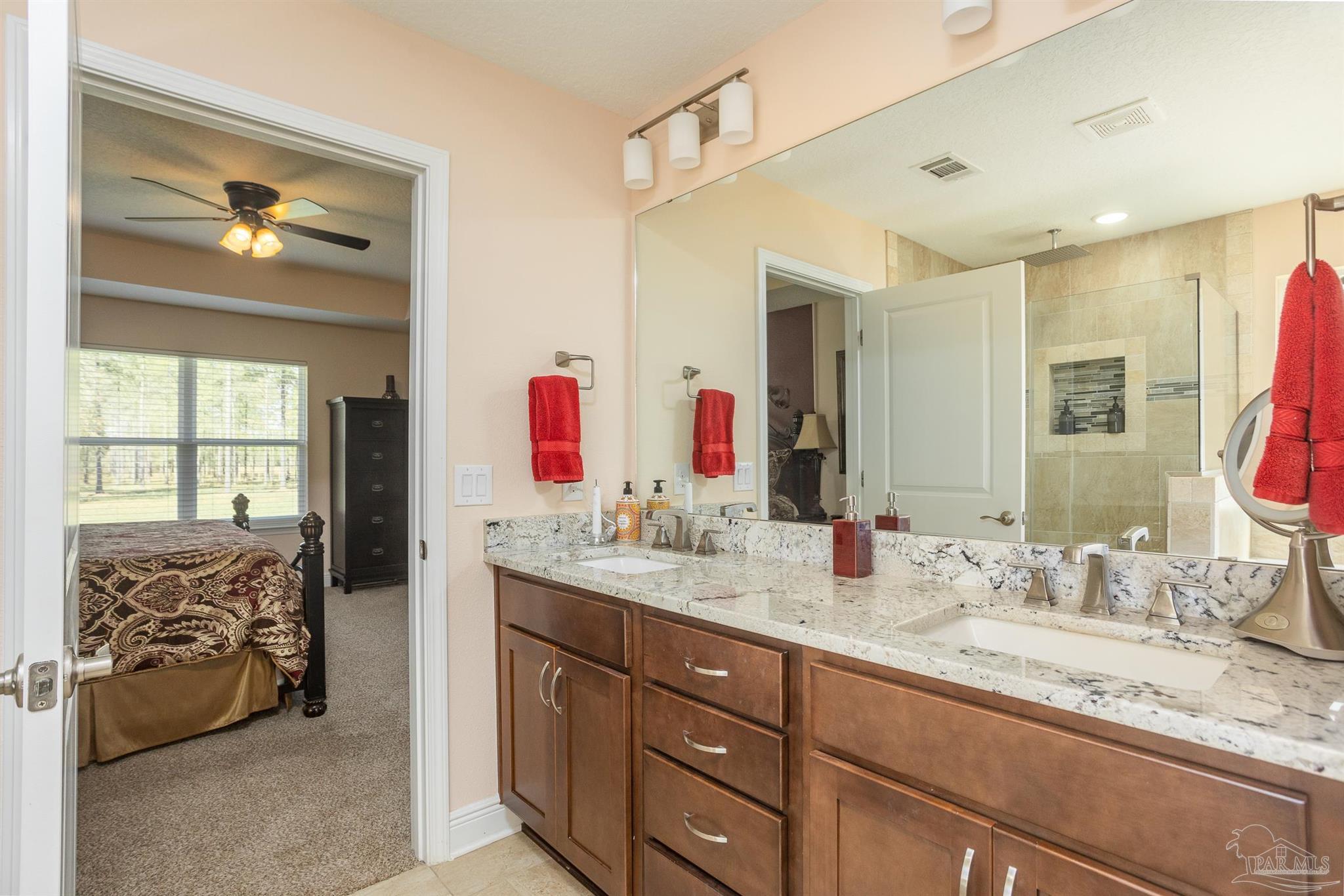 2383 Bud Diamond Road Jay, FL 32565 - Photo 21 of 50 a bathroom with a granite countertop sink mirror and double