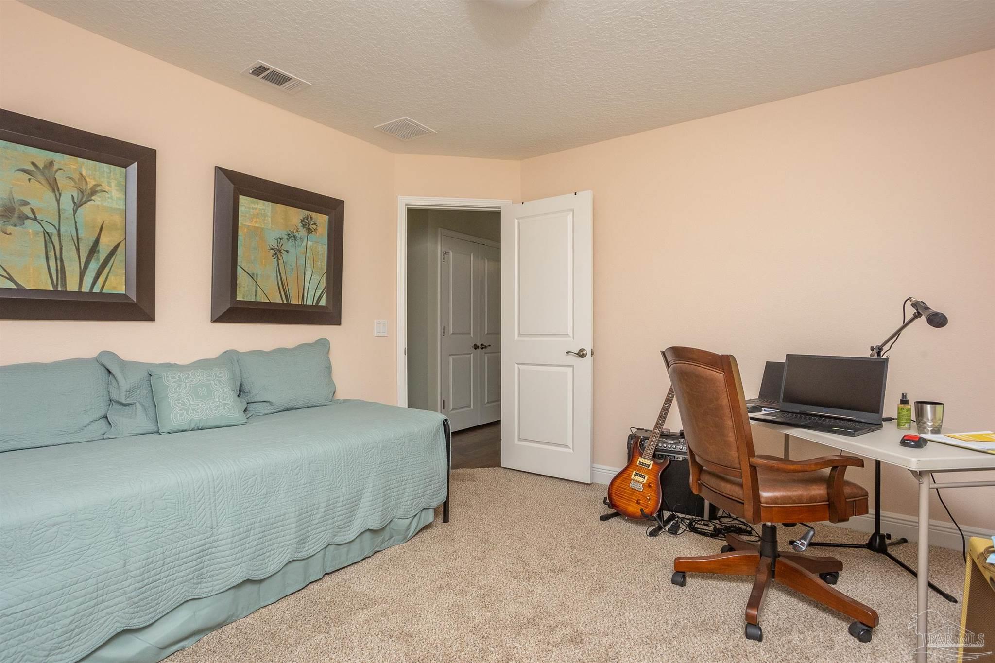2383 Bud Diamond Road Jay, FL 32565 - Photo 28 of 50 a bedroom with a workspace