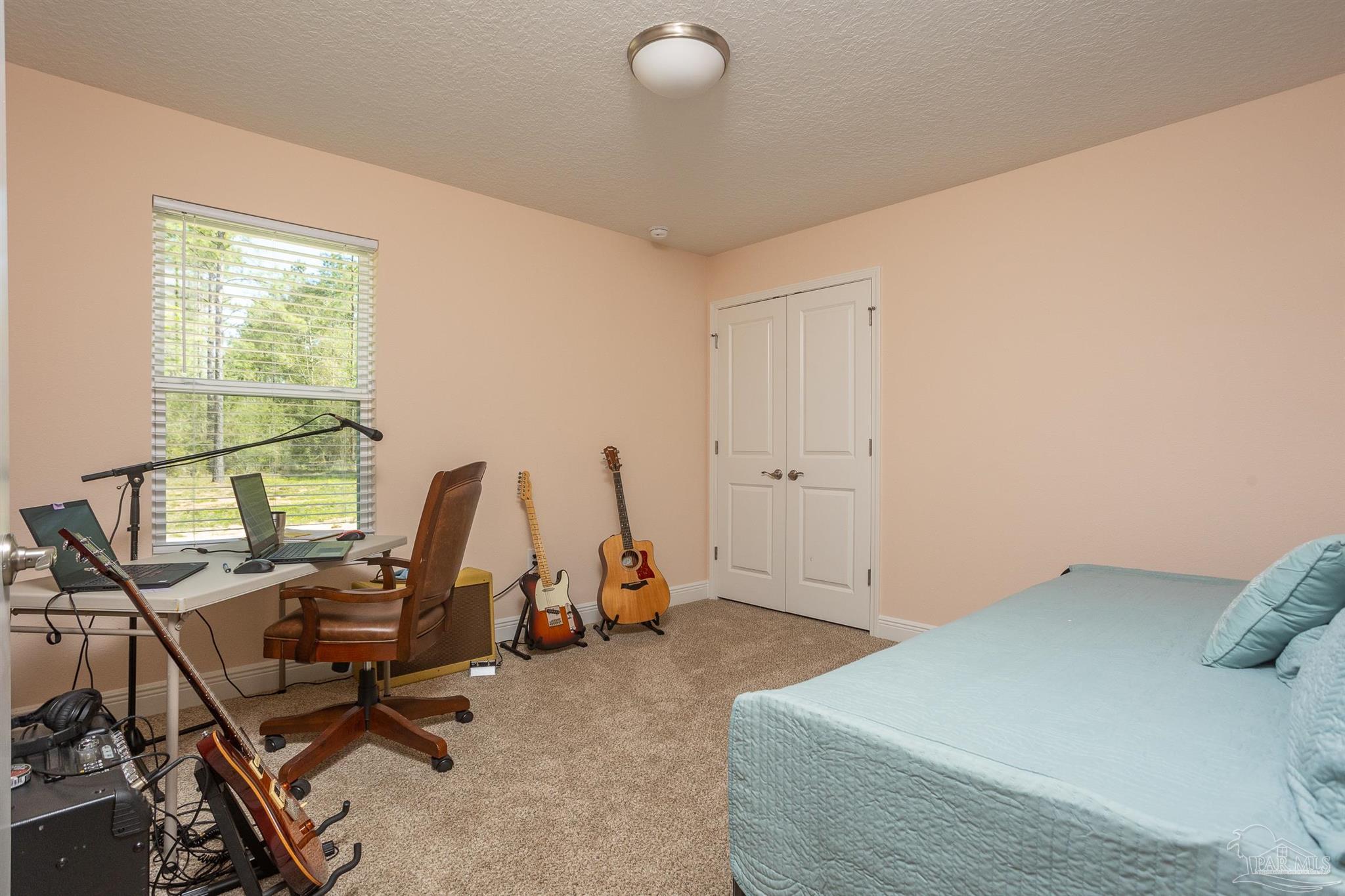 2383 Bud Diamond Road Jay, FL 32565 - Photo 29 of 50 a view of a room with gym equipment