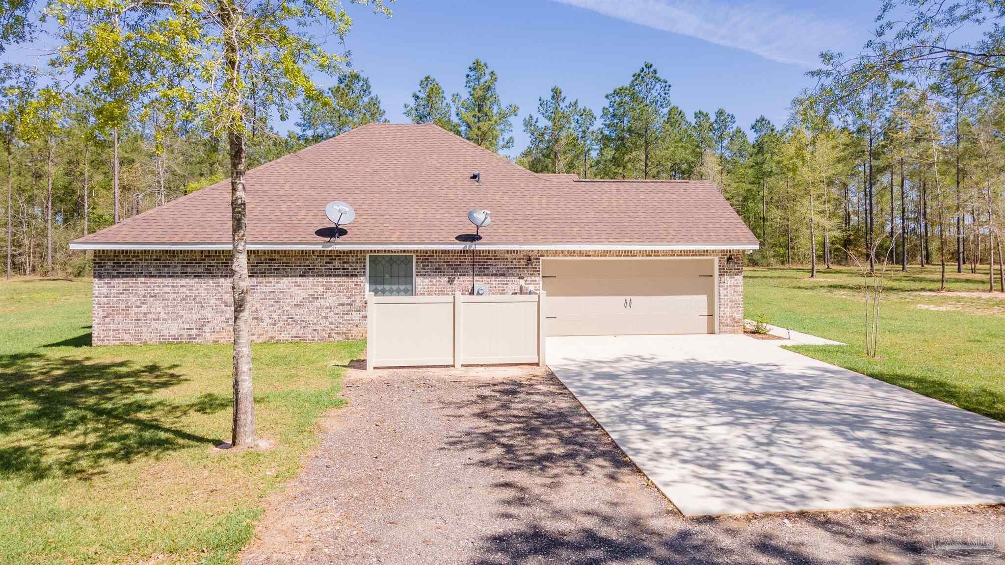 2383 Bud Diamond Road Jay, FL 32565 - Photo 30 of 50 a view of a house with a yard