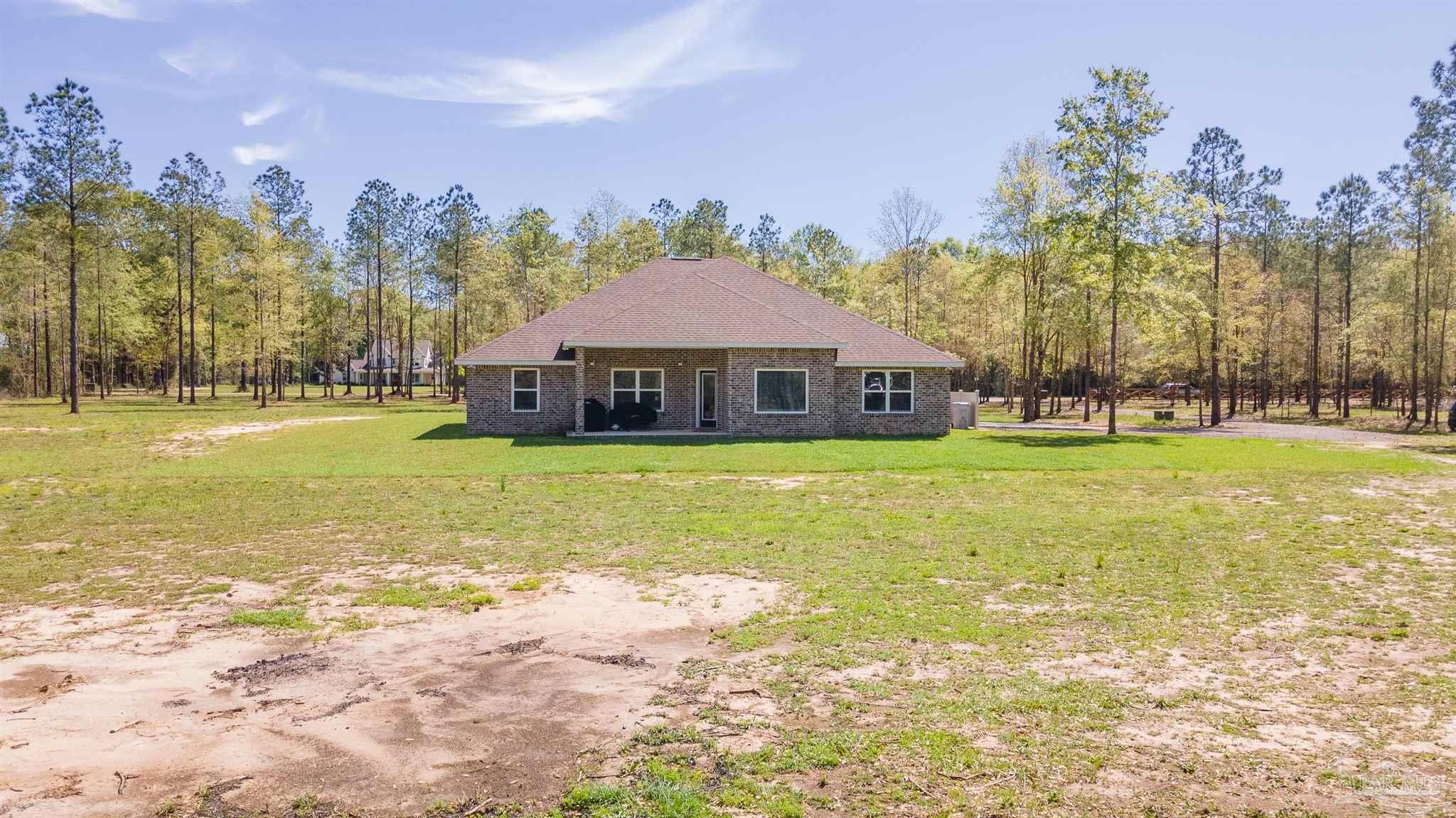 2383 Bud Diamond Road Jay, FL 32565 - Photo 31 of 50 a view of a house with a yard