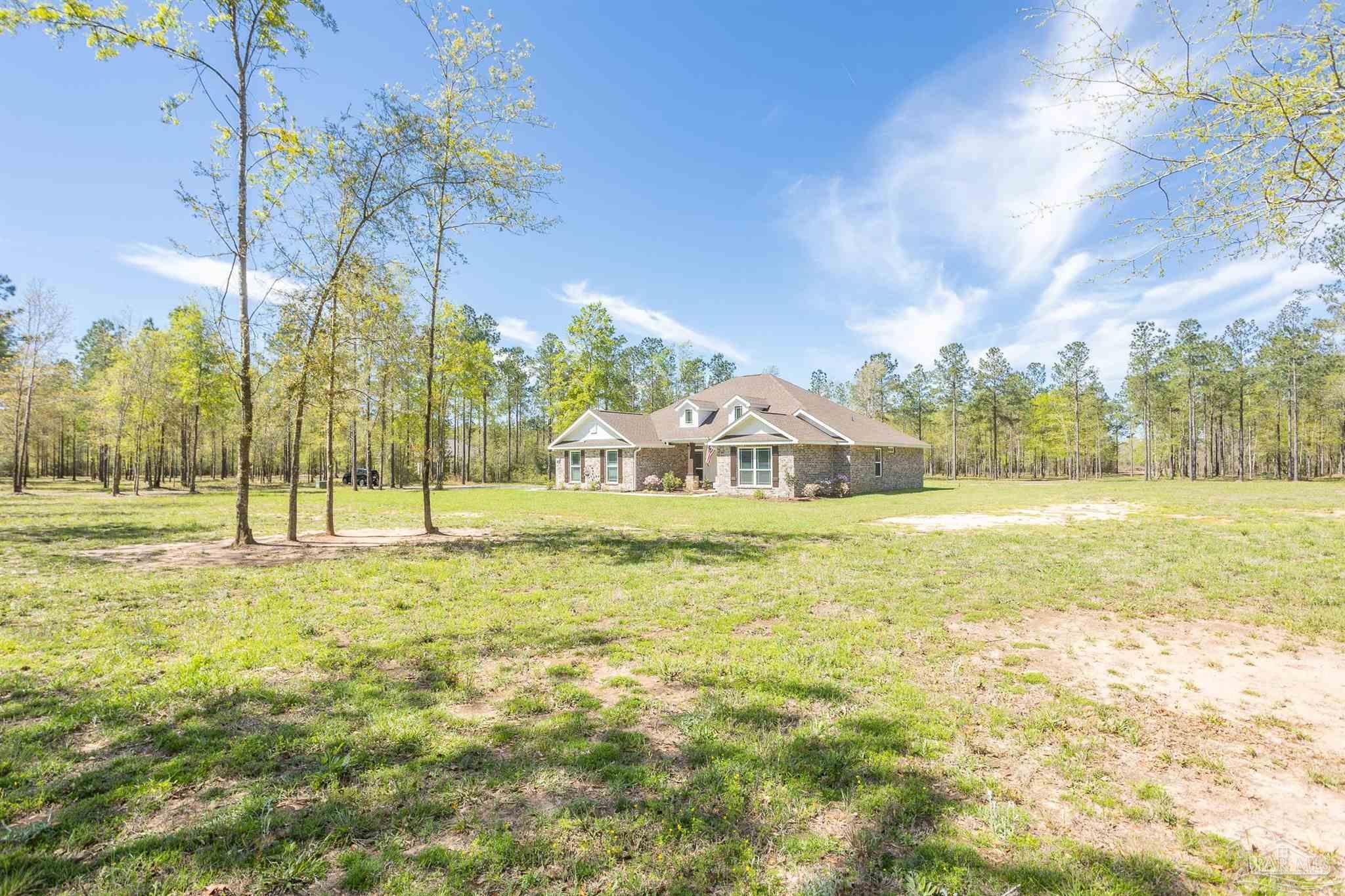 2383 Bud Diamond Road Jay, FL 32565 - Photo 38 of 50 a view of a house with a yard