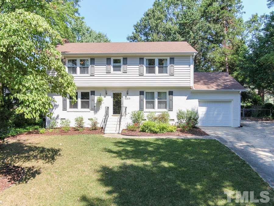 5305 Mapleridge Road Raleigh, NC 27609 - Photo 1 of 25 a front view of a house with a yard