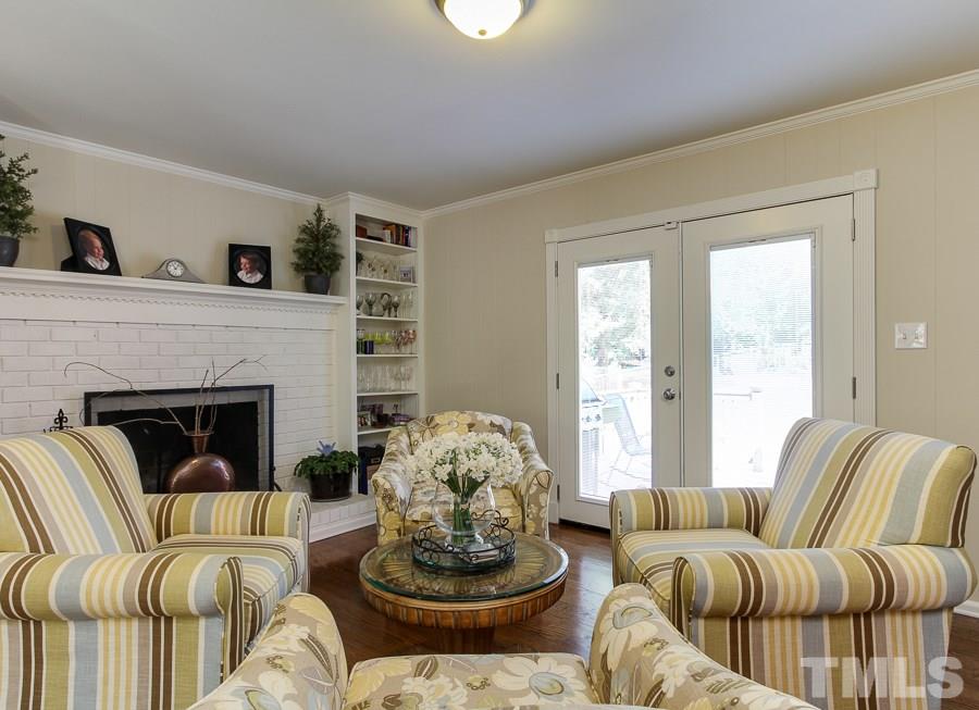 5305 Mapleridge Road Raleigh, NC 27609 - Photo 14 of 25 a living room with furniture and a fireplace
