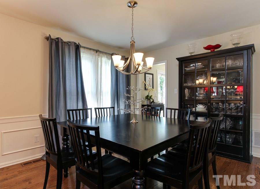 5305 Mapleridge Road Raleigh, NC 27609 - Photo 4 of 25 a dining room with furniture window and wooden floor